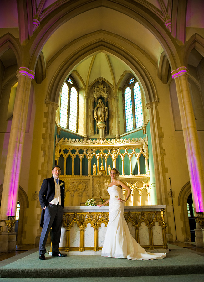 Couple stand at alter of chapel
